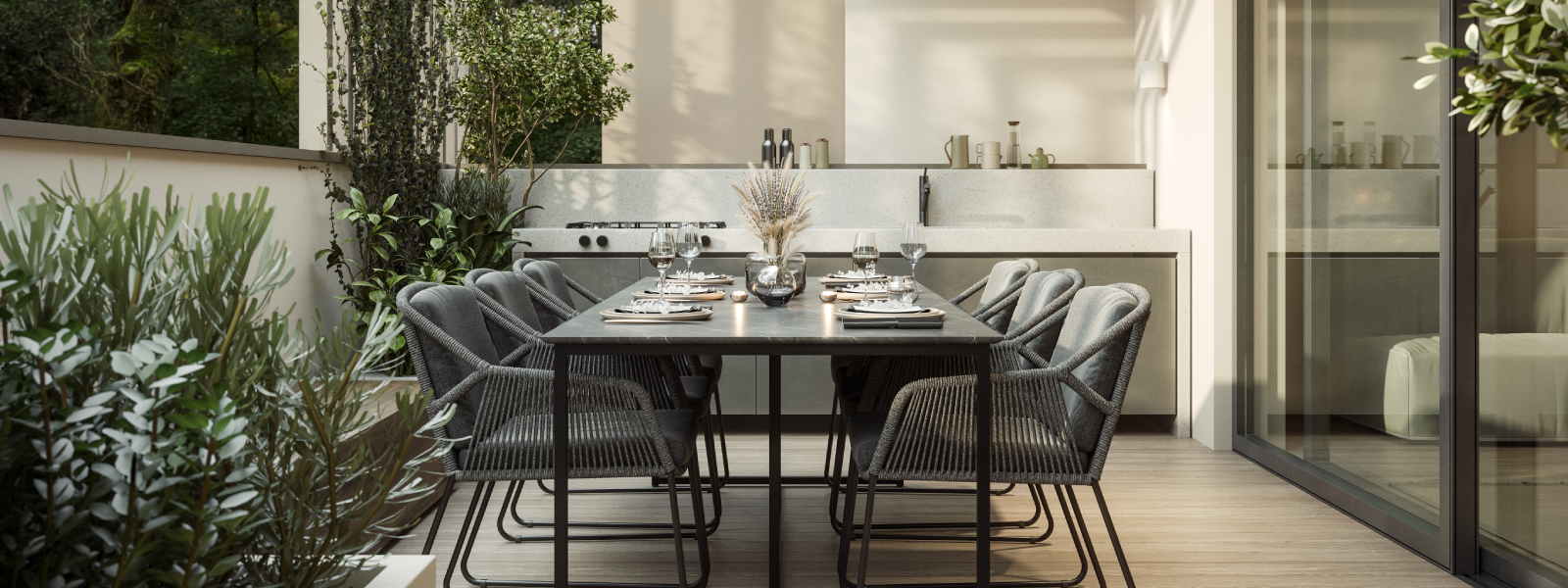 Covered modern patio with outdoor kitchen counter, dining table, and slatted pergola structure